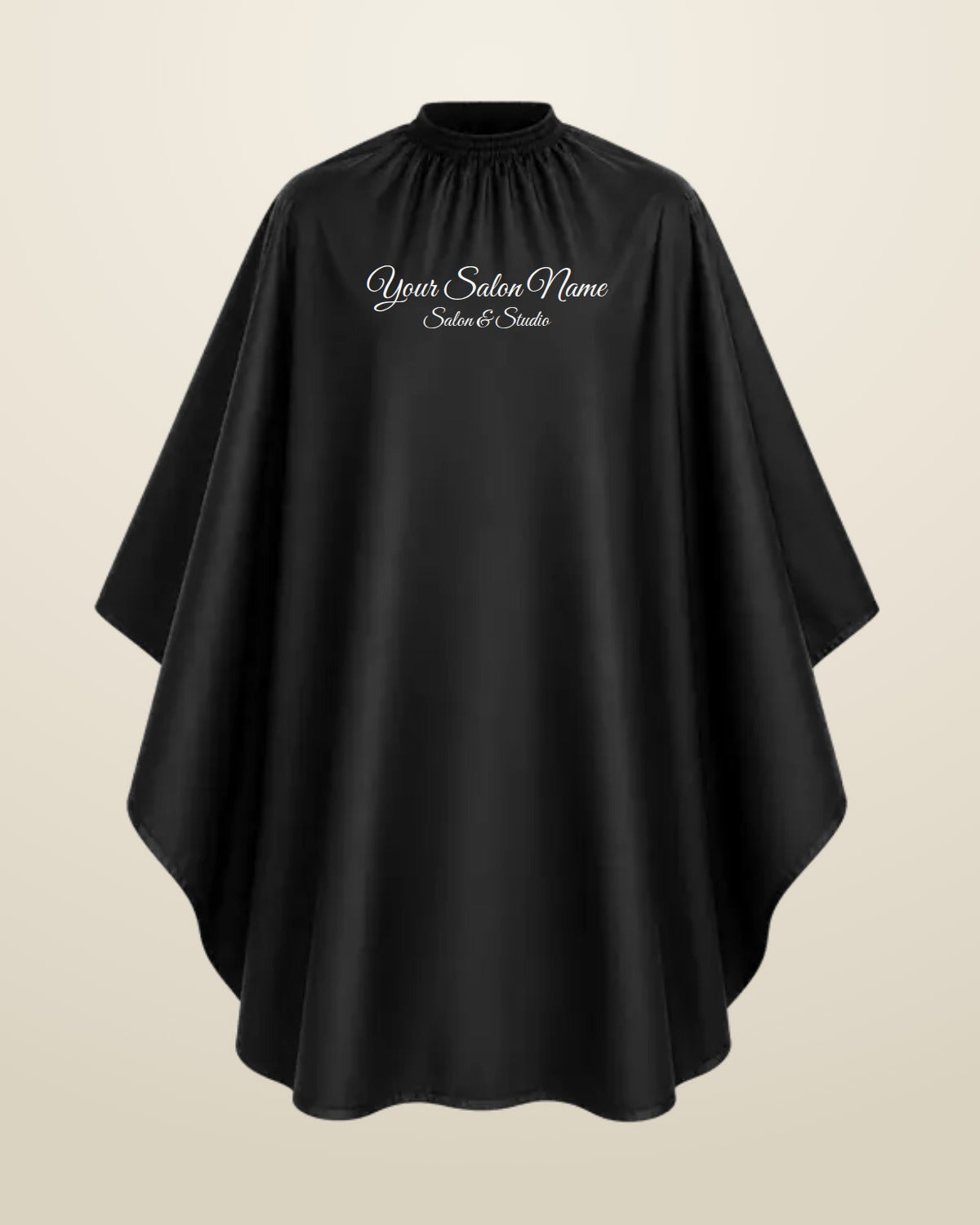 Embroidered black salon cape with a salon name stitched on it